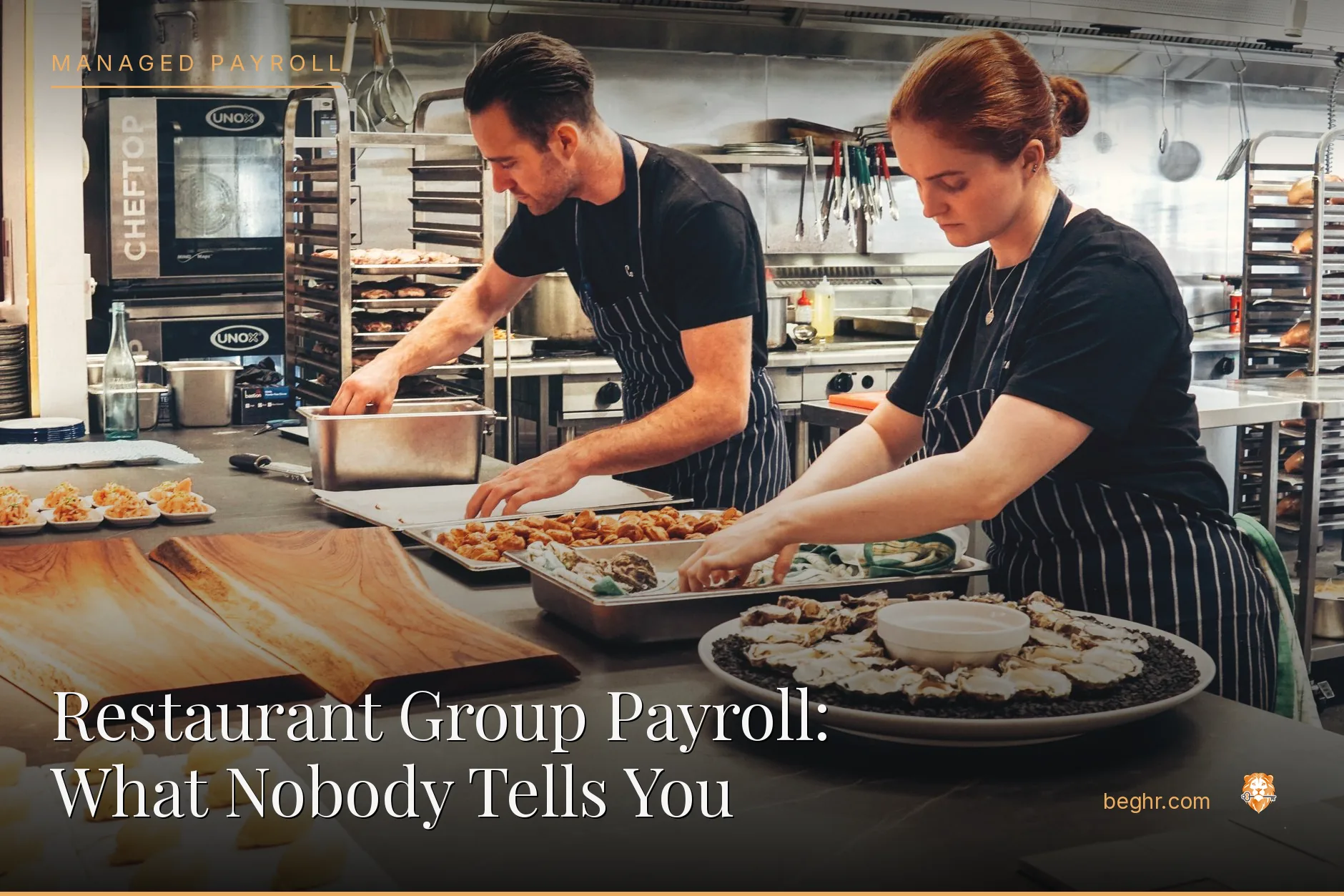 A busy modern restaurant kitchen with chefs and staff working the line