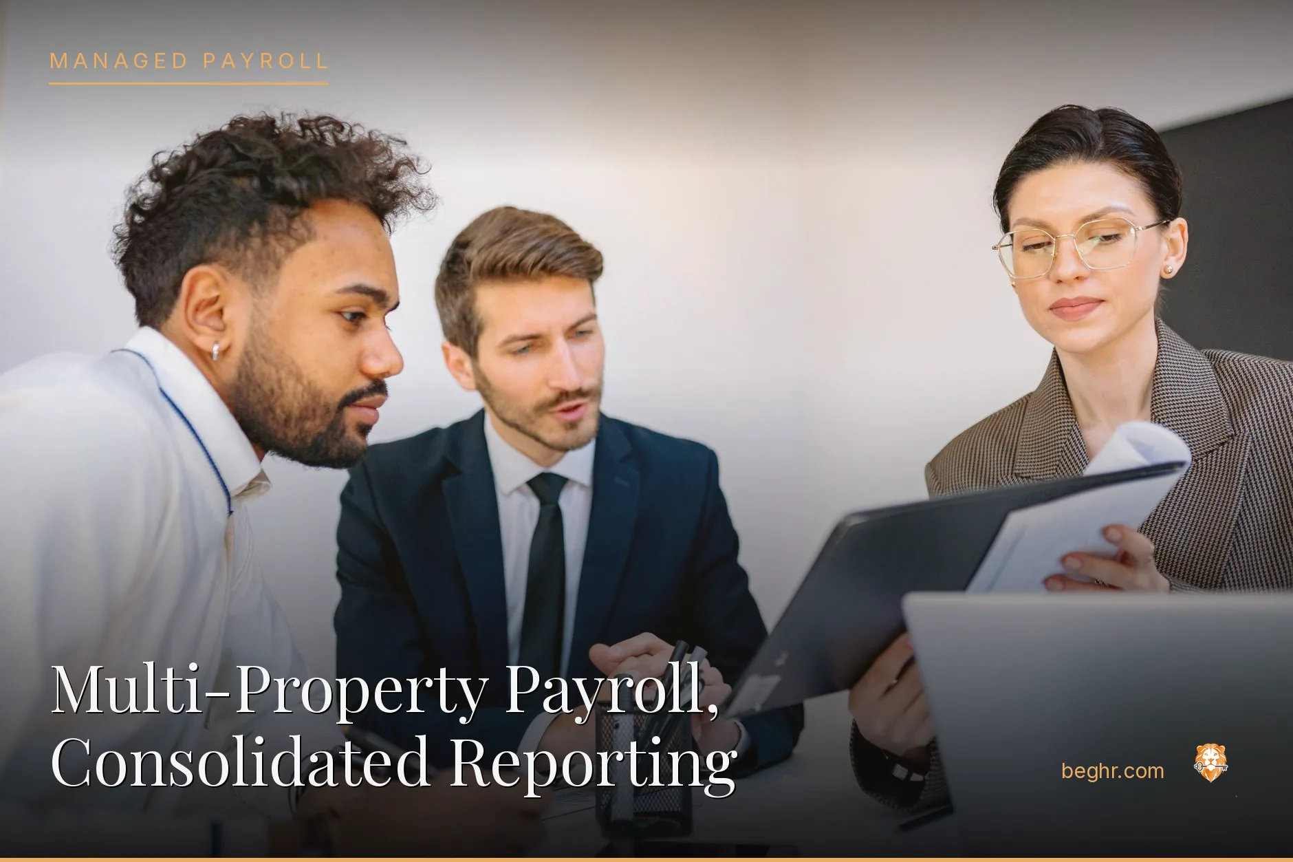 Business professionals reviewing payroll and HR documents in a bright modern office
