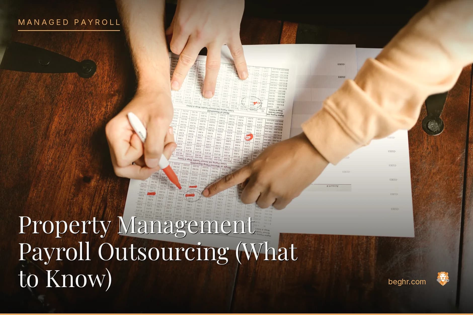 Business professionals reviewing payroll and HR documents in a bright modern office