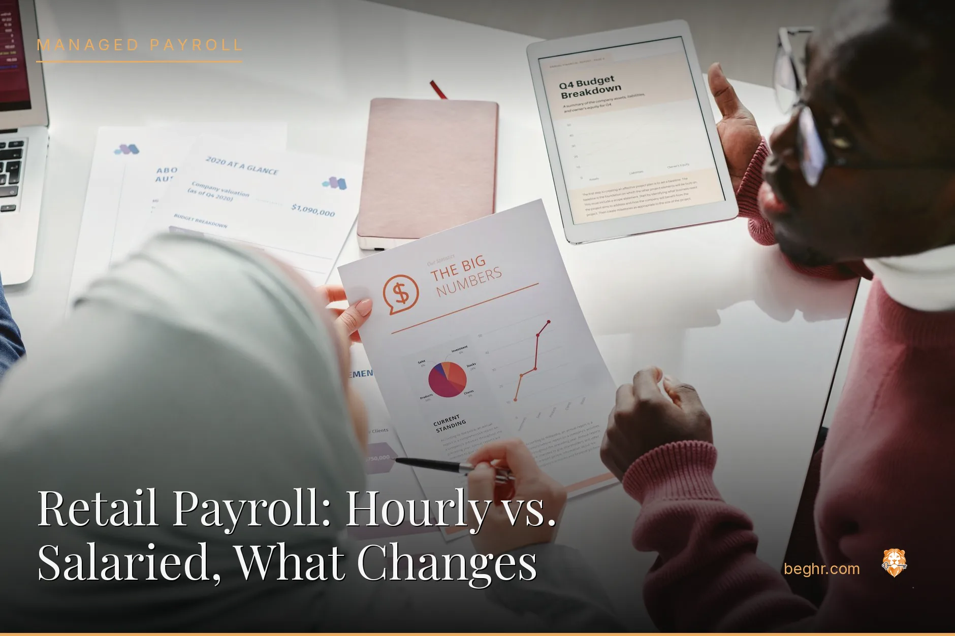 Business professionals reviewing payroll and HR documents in a bright modern office