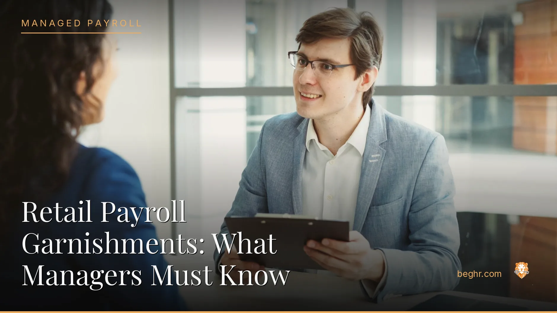 Business professionals reviewing payroll and HR documents in a bright modern office