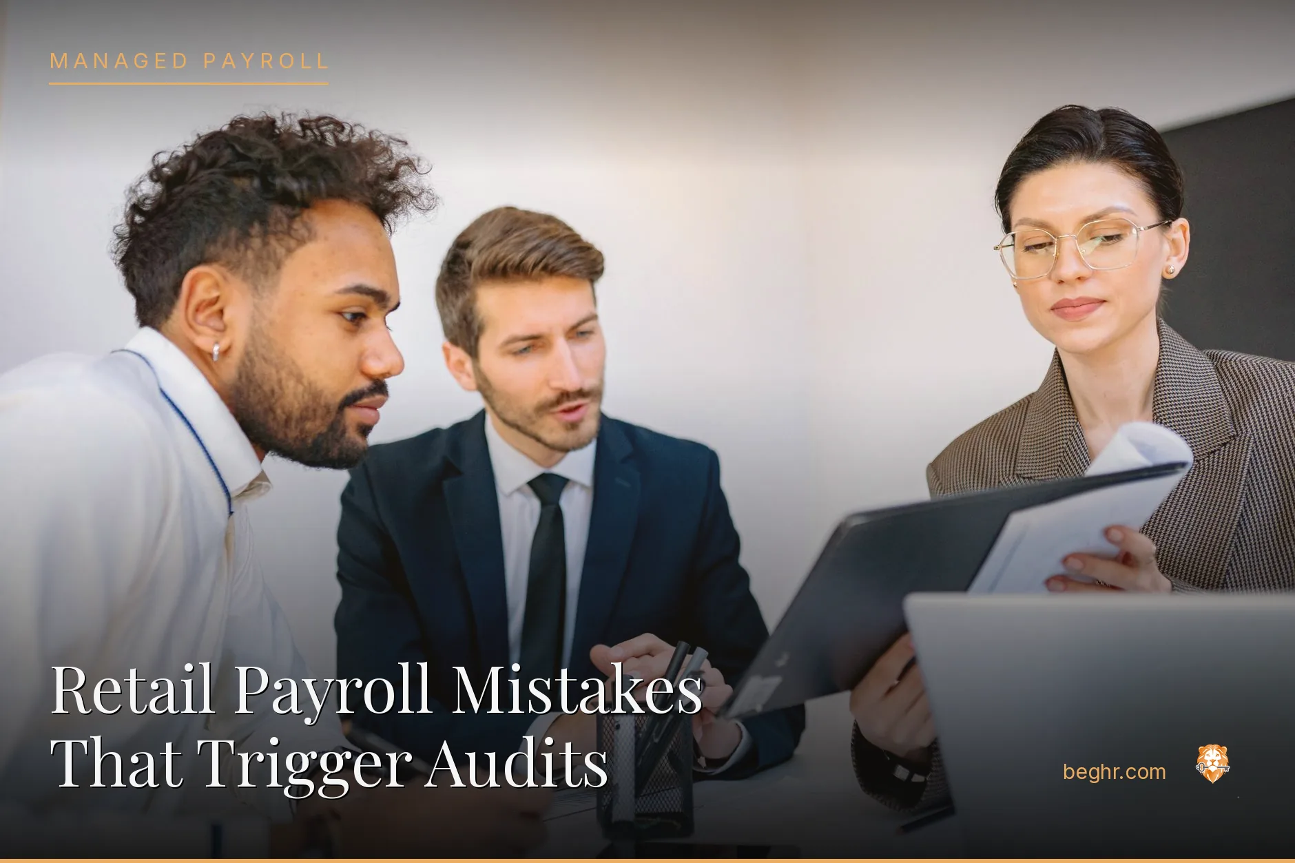 Business professionals reviewing payroll and HR documents in a bright modern office