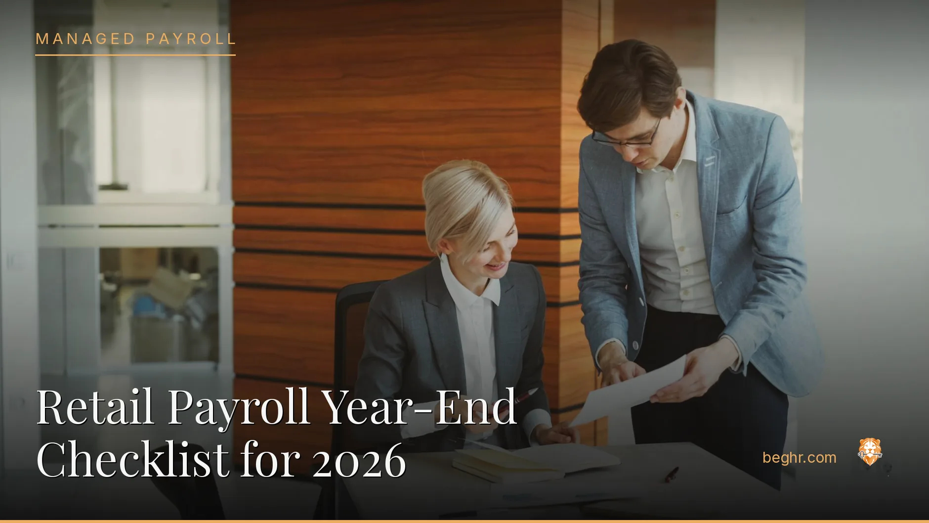 Business professionals reviewing payroll and HR documents in a bright modern office