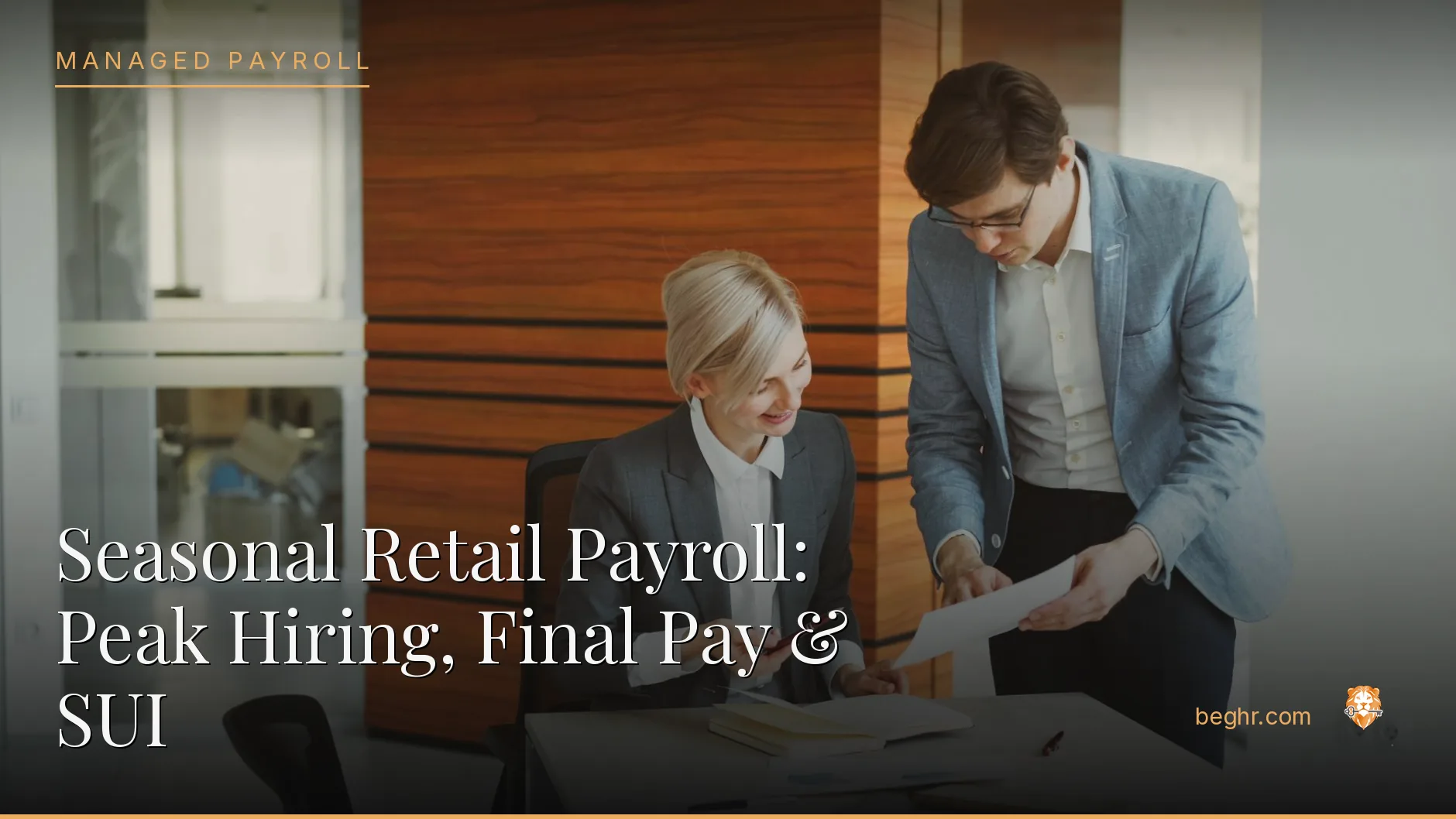 Business professionals reviewing payroll and HR documents in a bright modern office