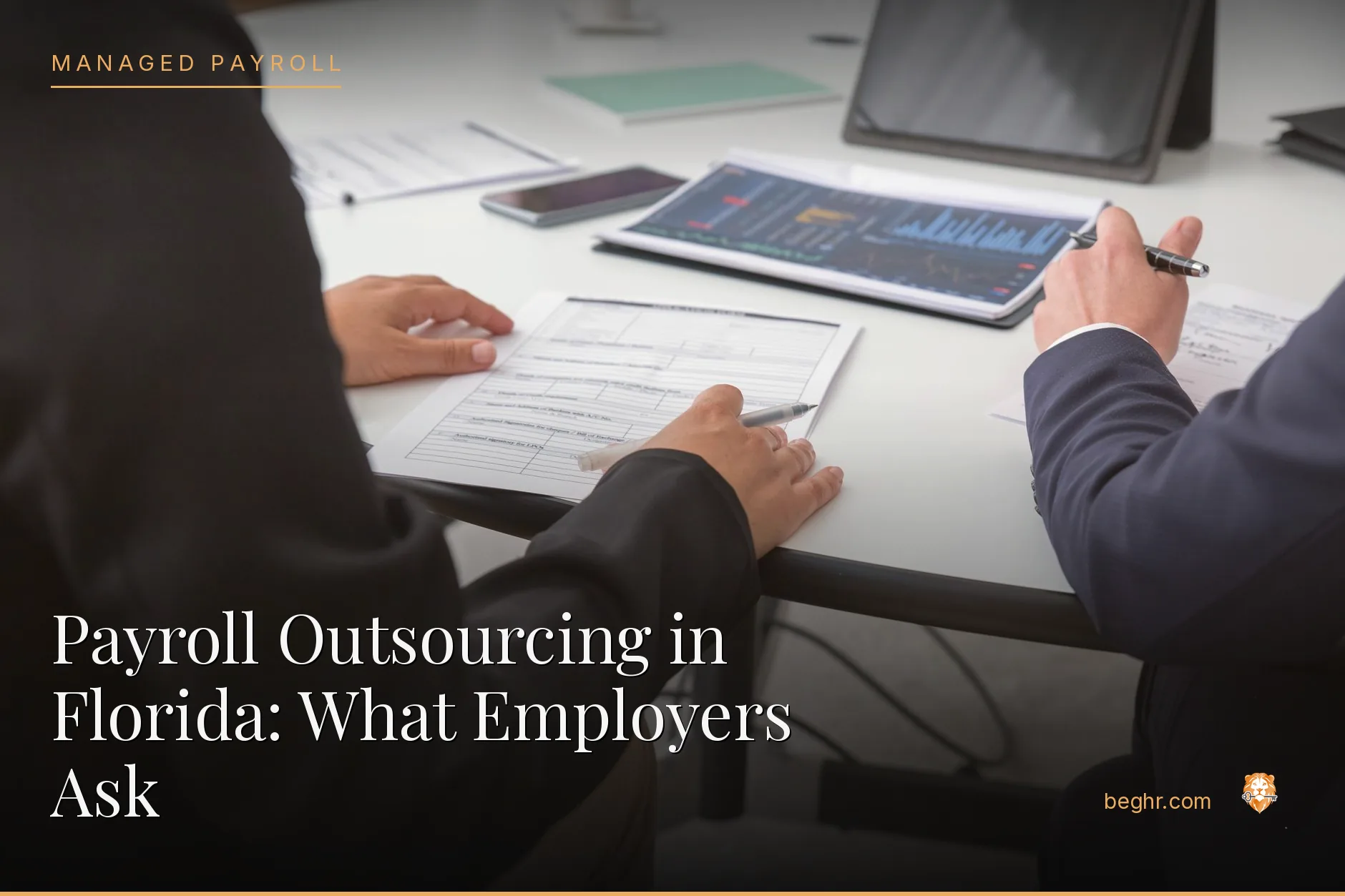 Business professionals reviewing payroll and HR documents in a bright modern office