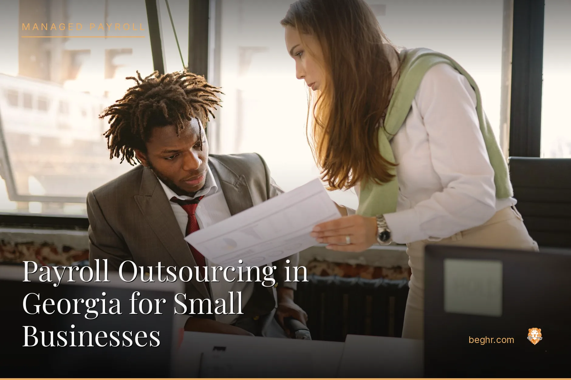 Business professionals reviewing payroll and HR documents in a bright modern office