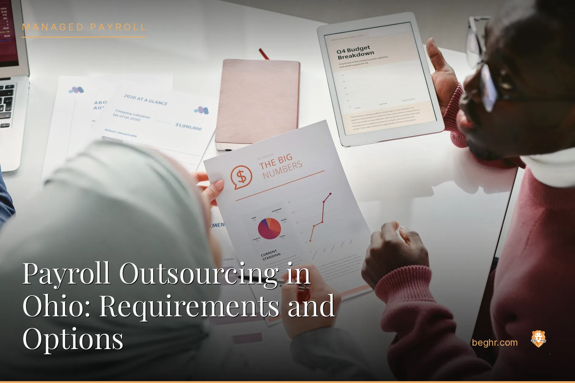 Business professionals reviewing payroll and HR documents in a bright modern office
