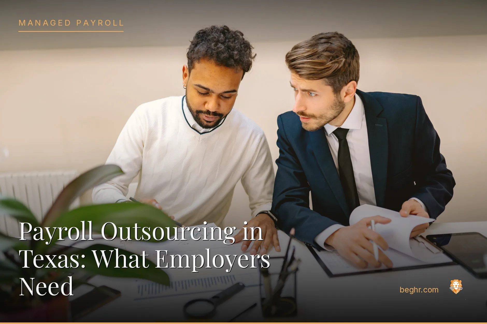 Business professionals reviewing payroll and HR documents in a bright modern office