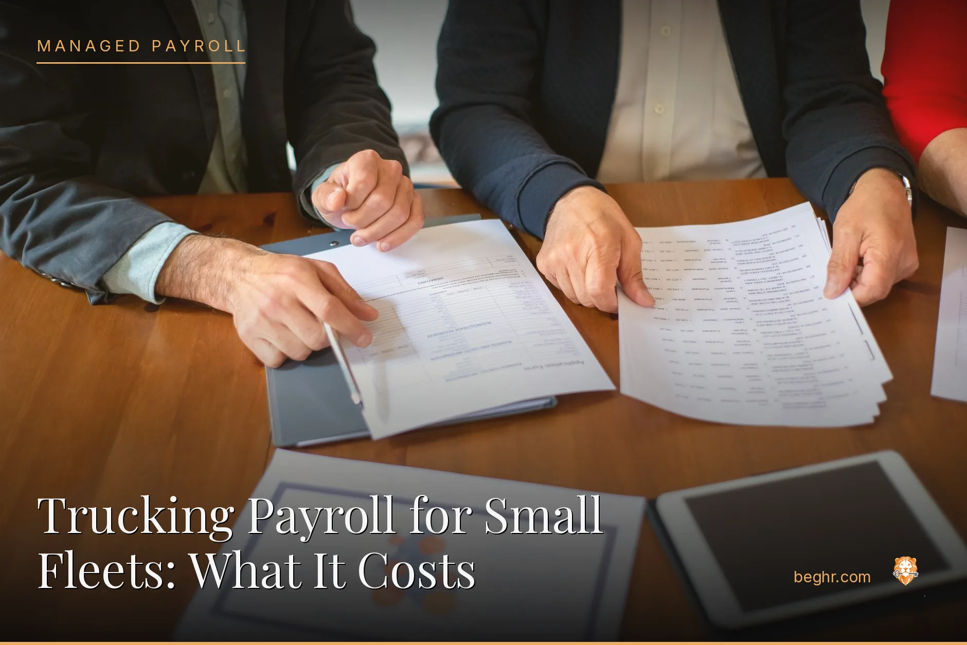 Business professionals reviewing payroll and HR documents in a bright modern office