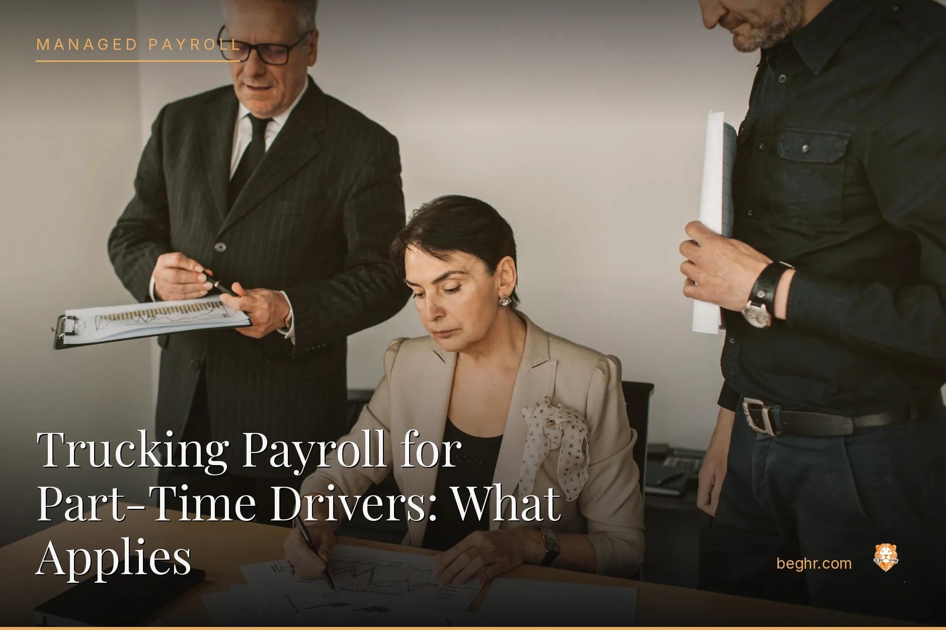 Business professionals reviewing payroll and HR documents in a bright modern office