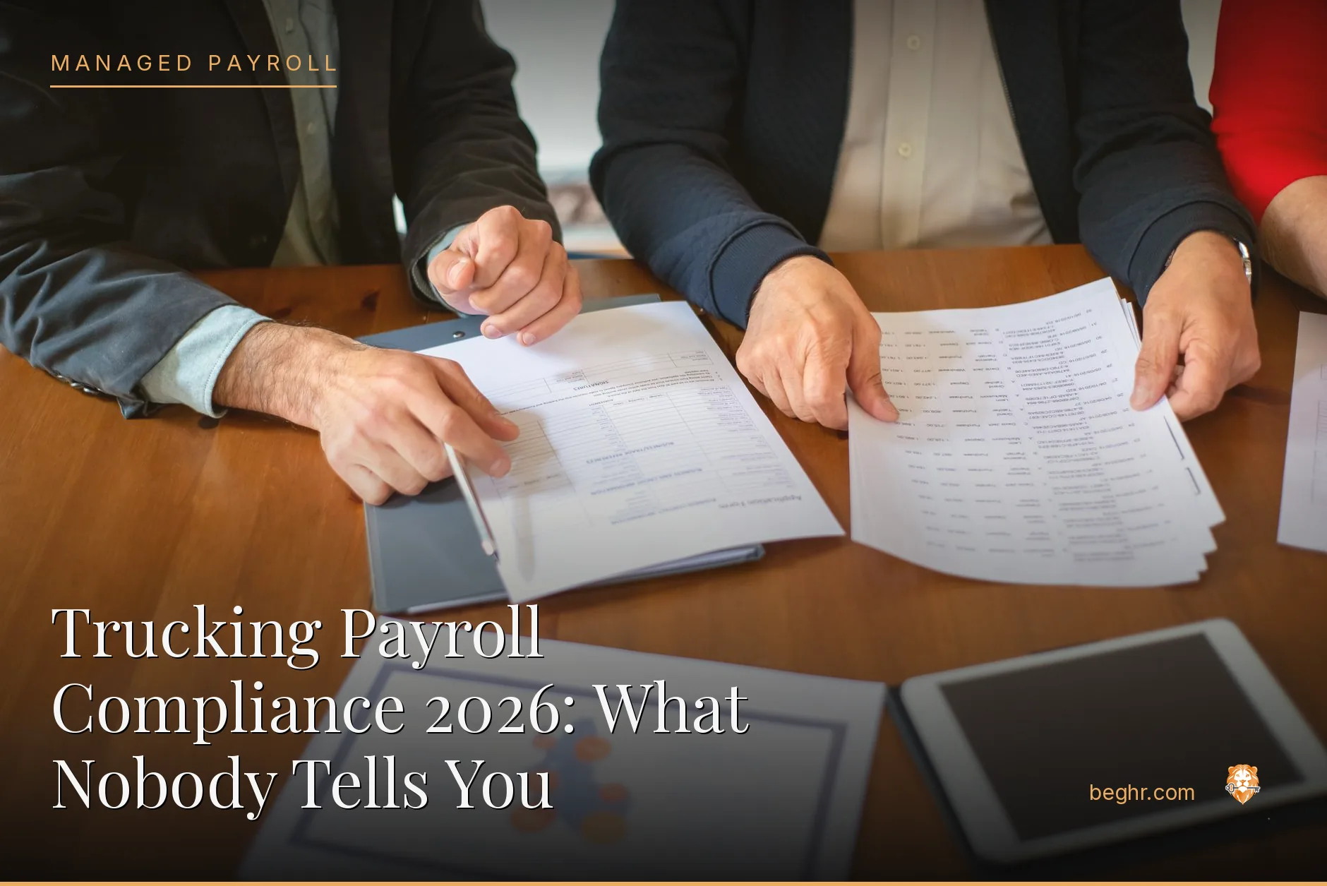 Business professionals reviewing payroll and HR documents in a bright modern office