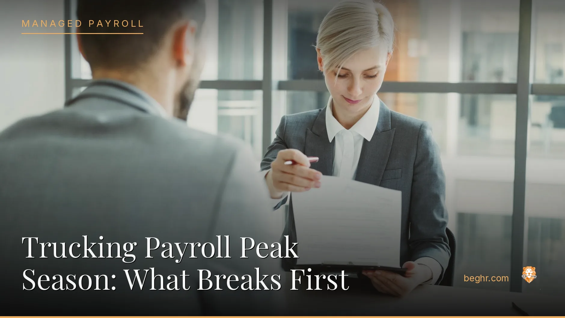 Business professionals reviewing payroll and HR documents in a bright modern office