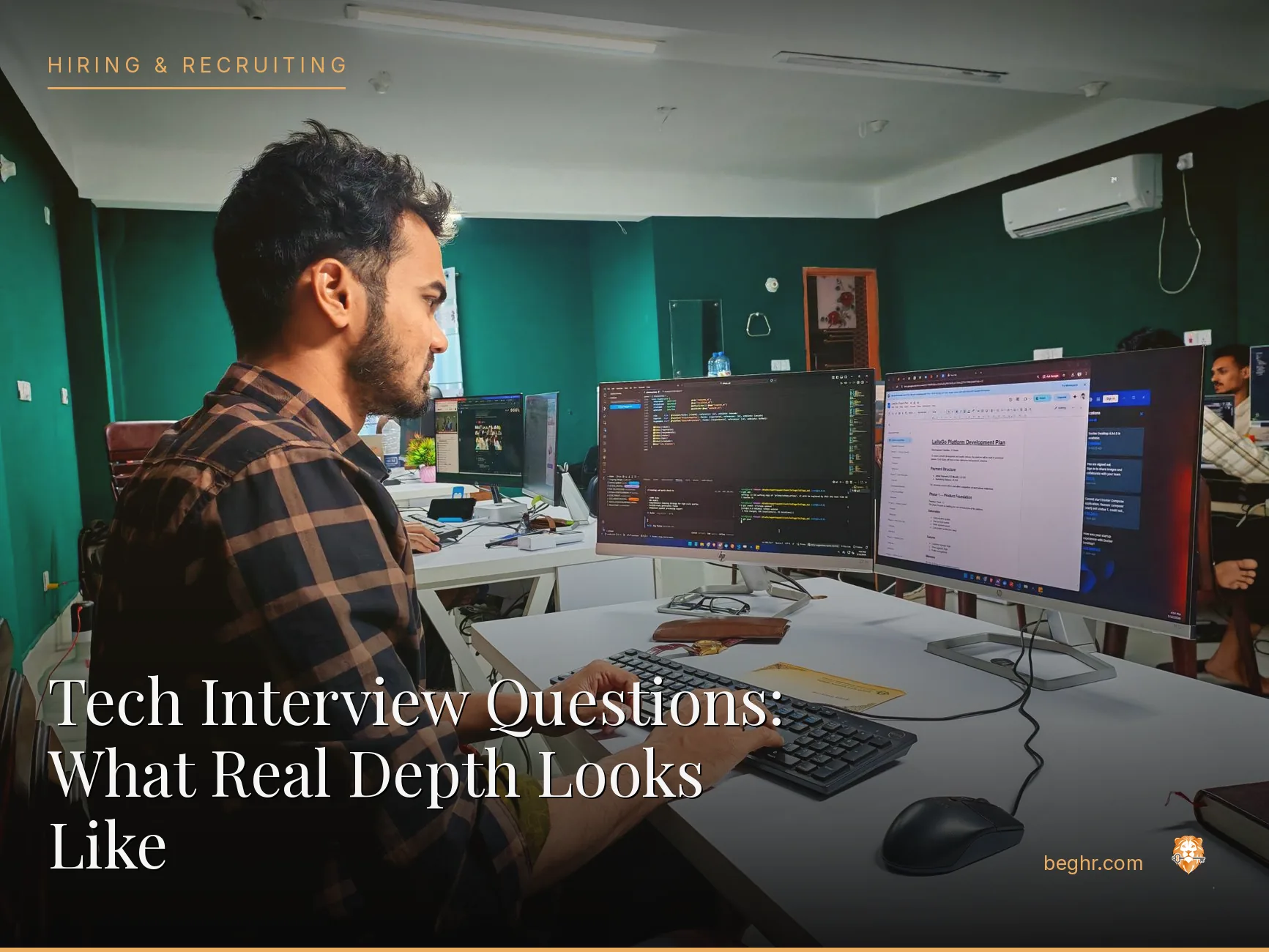 A modern tech office, software team collaborating at workstations